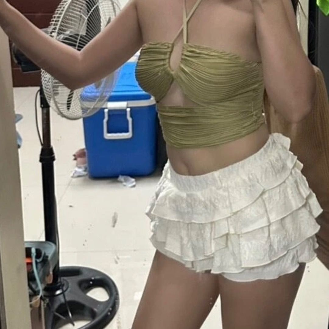 Cream Ruffle Skort (Category: Sets or Coordinates) located in Paranaque City. Submitted by yanie.ae (Listing ID 1470165654, Image 2). Description: - Bottoms: White layered ruffle shorts with a comfortable elastic waistband - Material: Soft, high-quality, and comfortable fit - Best For: Casual days out, beach trips, or vacays.