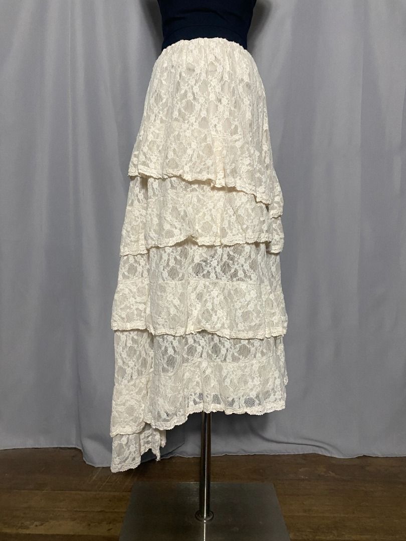 Cream tiered lace asymmetrical skirt (Category: Skirts) located in Las Pinas. Submitted by ipickyou (Listing ID 1470291346, Image 3). Description: Unwashed Condition: 10/10 𝗠𝗲𝗮𝘀𝘂𝗿𝗲𝗺𝗲𝗻𝘁𝘀 𝘄𝗵𝗲𝗻 𝗹𝗮𝗶𝗱 𝗳𝗹𝗮𝘁: -Waist: 13-21” -Length: 31-38” .