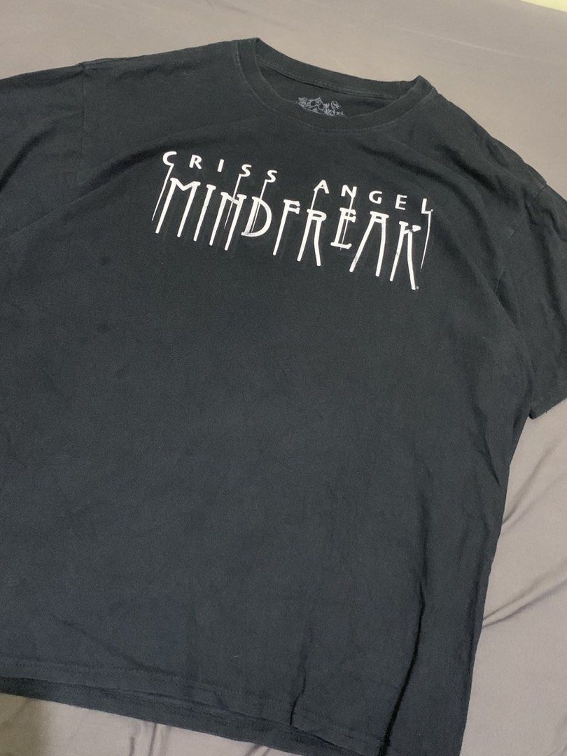 Criss Angel mindFreak (Category: Tshirts & Polo Shirts ) located in Roxas City. Submitted by vaultcultureco. (Listing ID 1470288531, Image 3). Description: - Brand: MF Apparel / Criss Angel Mindfreak - Color: Black with white graphic print - Size: XL - Material: 100% Cotton - Condition: 7/10 (pre-owned with light vintage wear) - Features iconic Mindfreak logo and branded inner neck tag.