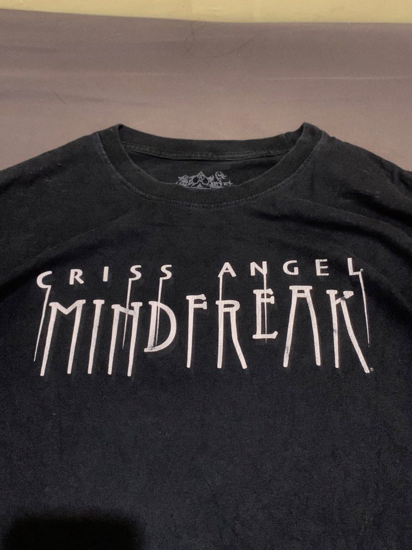 Criss Angel mindFreak (Category: Tshirts & Polo Shirts ) located in Roxas City. Submitted by vaultcultureco. (Listing ID 1470288531, Image 1). Description: - Brand: MF Apparel / Criss Angel Mindfreak - Color: Black with white graphic print - Size: XL - Material: 100% Cotton - Condition: 7/10 (pre-owned with light vintage wear) - Features iconic Mindfreak logo and branded inner neck tag.