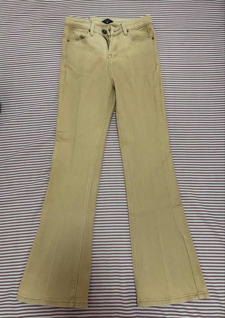 Crissa Beige Flare Jeans (Category: Jeans) located in San Pedro. Submitted by iarruh (Listing ID 1470158822, Image 1). Description: - Brand: Crissa - Color: Classic beige - Size: 27 (inner tag) - Fit: Mid to low rise waist with a subtle flared leg cut - Closure: Button fly with belt loops - Pockets: Classic five-pocket styling - Loc: San Pedro, Laguna.