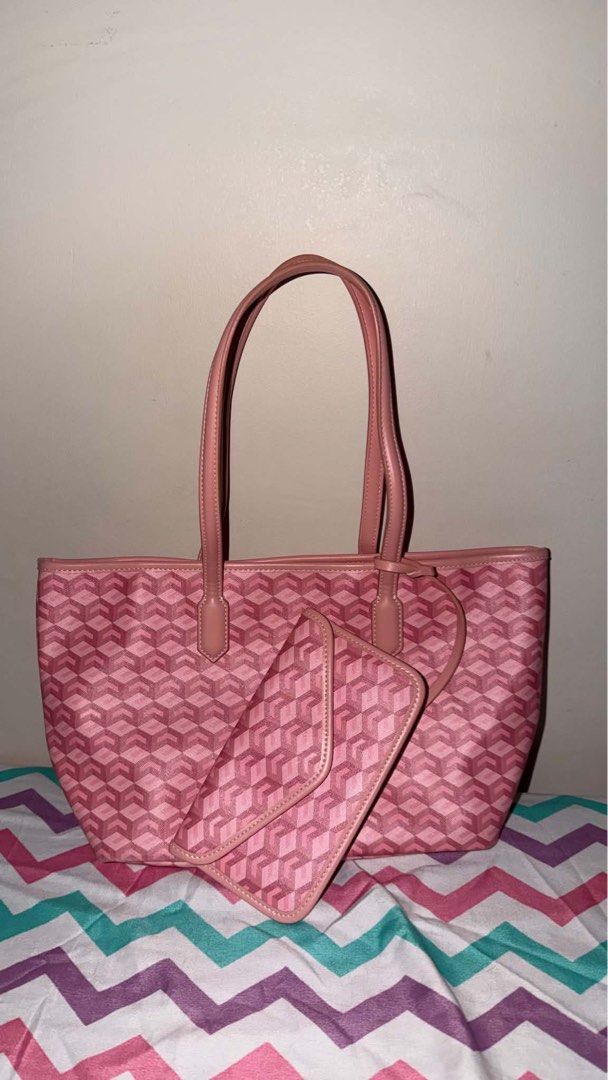 Cristy Ng Russo Medium Tote Bag (Category: Tote Bags) located in Caloocan City. Submitted by lokiyo (Listing ID 1470161991, Image 1). Description: - Pink tote bag with stylish all-over geometric pattern - Sturdy structure with comfortable dual shoulder straps - Roomy cream canvas interior complete with a pink base insert - Comes with a matching envelope-style pouch attached by a strap - Versatile and easy to match with your everyday casual outfit