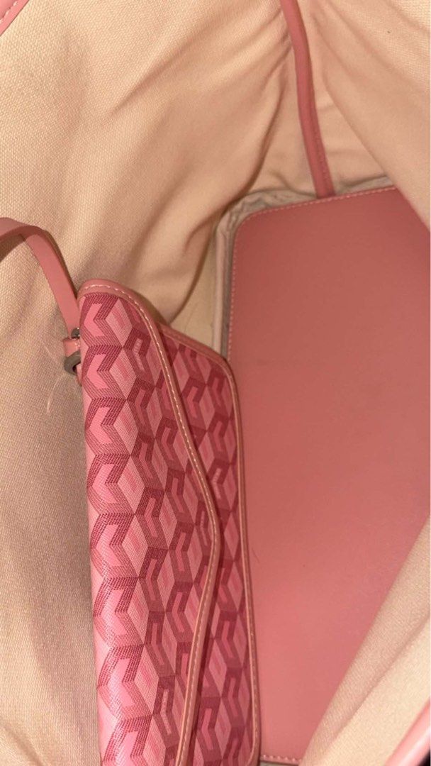 Cristy Ng Russo Medium Tote Bag (Category: Tote Bags) located in Caloocan City. Submitted by lokiyo (Listing ID 1470161991, Image 3). Description: - Pink tote bag with stylish all-over geometric pattern - Sturdy structure with comfortable dual shoulder straps - Roomy cream canvas interior complete with a pink base insert - Comes with a matching envelope-style pouch attached by a strap - Versatile and easy to match with your everyday casual outfit