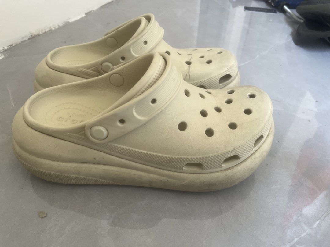 Crocs Classic Crush Clog Bone Off-White Platform Sandals (Category: Sandals) located in Bulacan. Submitted by jhemieee (Listing ID 1470191178, Image 1). Description: - Color: Bone - Size (7-Men) (9- Wmn) - Style: Classic Crush Clog with chunky platform sole - Comfort: Iconic Crocs comfort footbed and adjustable heel strap - Breathability: Ventilation ports on top and around the midsole - Condition: Regular signs of wear on soles and sides from no