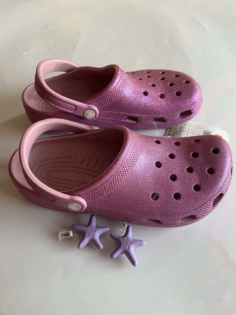 Crocs Classic Glitter Clog (Category: Sandals) located in Santa Rosa. Submitted by ninaparis (Listing ID 1470220118, Image 3). Description: Original Crocs Classic Glitter Clog size W9 M7 With free 2 Jibitz color purple.