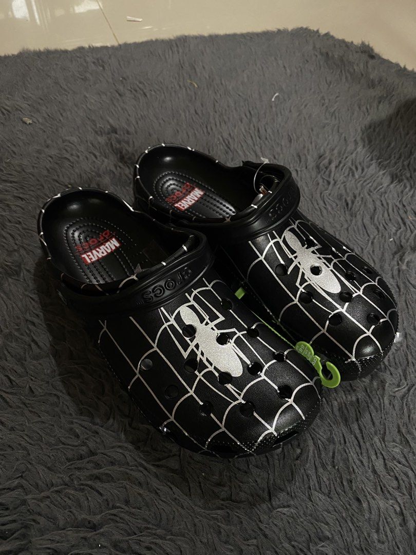 Crocs Spider-Man Marvel Clogs (Category: Slippers & Slides) located in Manila. Submitted by rovinxrx (Listing ID 1470294155, Image 1). Description: Spider-Man themed clogs featuring a custom spider-web print. Comfortable slip-on style with a secure heel strap and ventilation holes. Perfect everyday footwear for Marvel fans!.