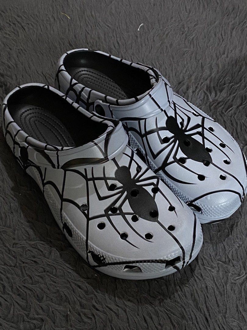 Crocs Spider-Man Marvel Clogs (Category: Slippers & Slides) located in Manila. Submitted by rovinxrx (Listing ID 1470294155, Image 3). Description: Spider-Man themed clogs featuring a custom spider-web print. Comfortable slip-on style with a secure heel strap and ventilation holes. Perfect everyday footwear for Marvel fans!.