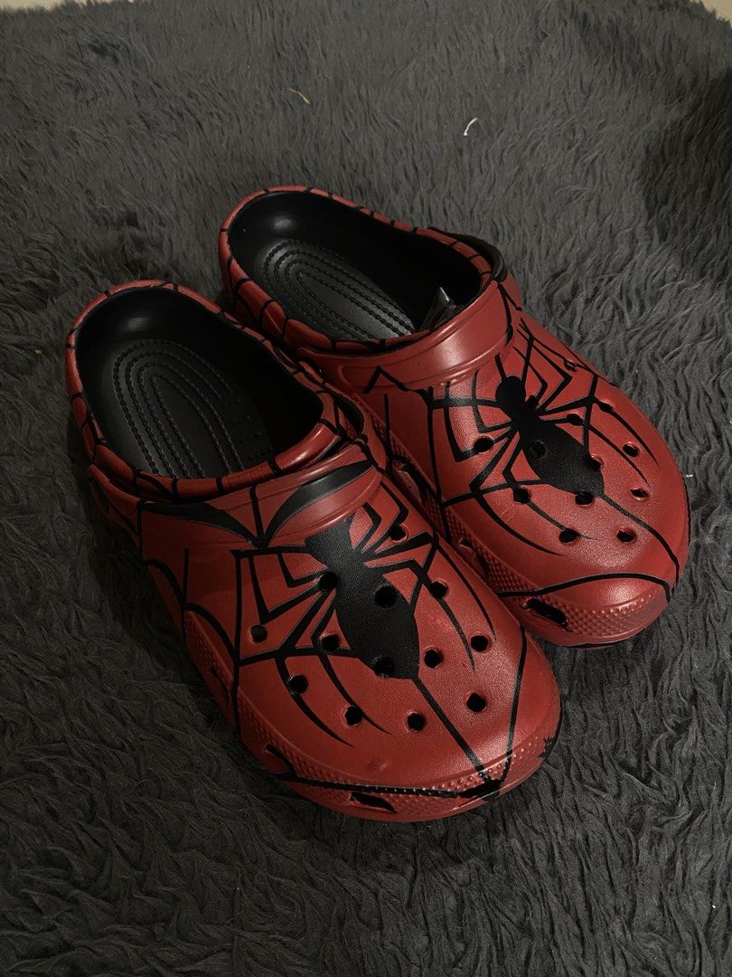 Crocs Spider-Man Marvel Clogs (Category: Slippers & Slides) located in Manila. Submitted by rovinxrx (Listing ID 1470294155, Image 2). Description: Spider-Man themed clogs featuring a custom spider-web print. Comfortable slip-on style with a secure heel strap and ventilation holes. Perfect everyday footwear for Marvel fans!.