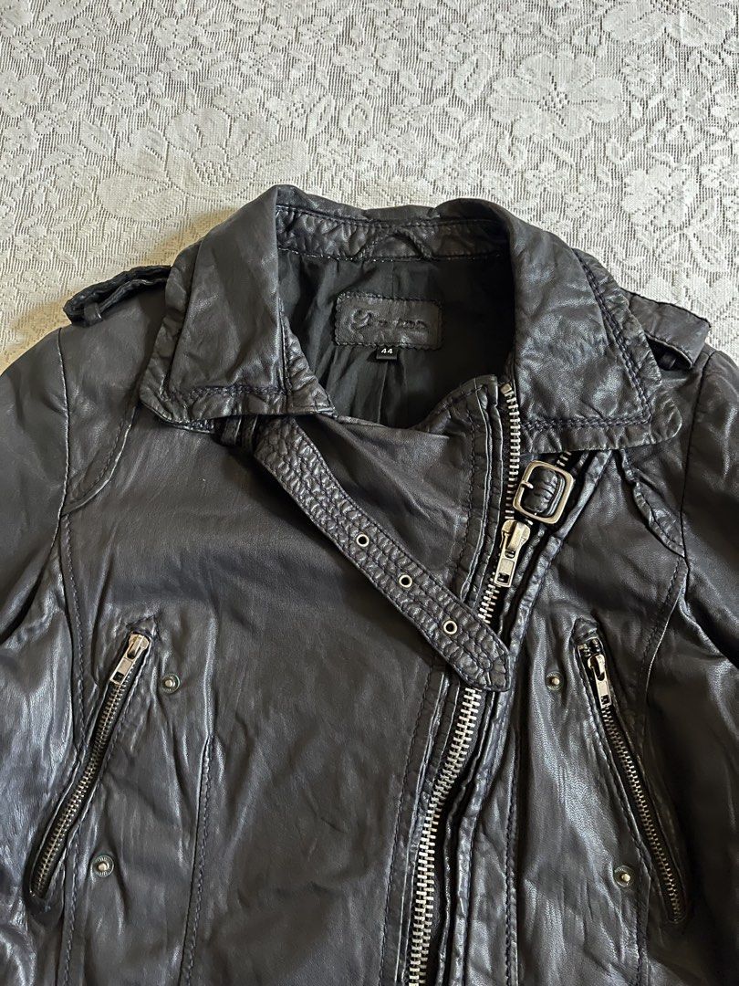 Cropped Black leather biker jacket (Category: Coats, Jackets and Outerwear) located in Baguio. Submitted by dutefinds (Listing ID 1470347373, Image 2). Description: - Style: Black leather motorcycle jacket with asymmetrical front zipper - Hardware: Silver-tone zippers, pockets, and cuff snaps - Details: Adjustable buckle on the lapel and back hem - Interior: Fully lined with black fabric - Size: Tagged Size 44 - Condition: Excellent pre-loved con