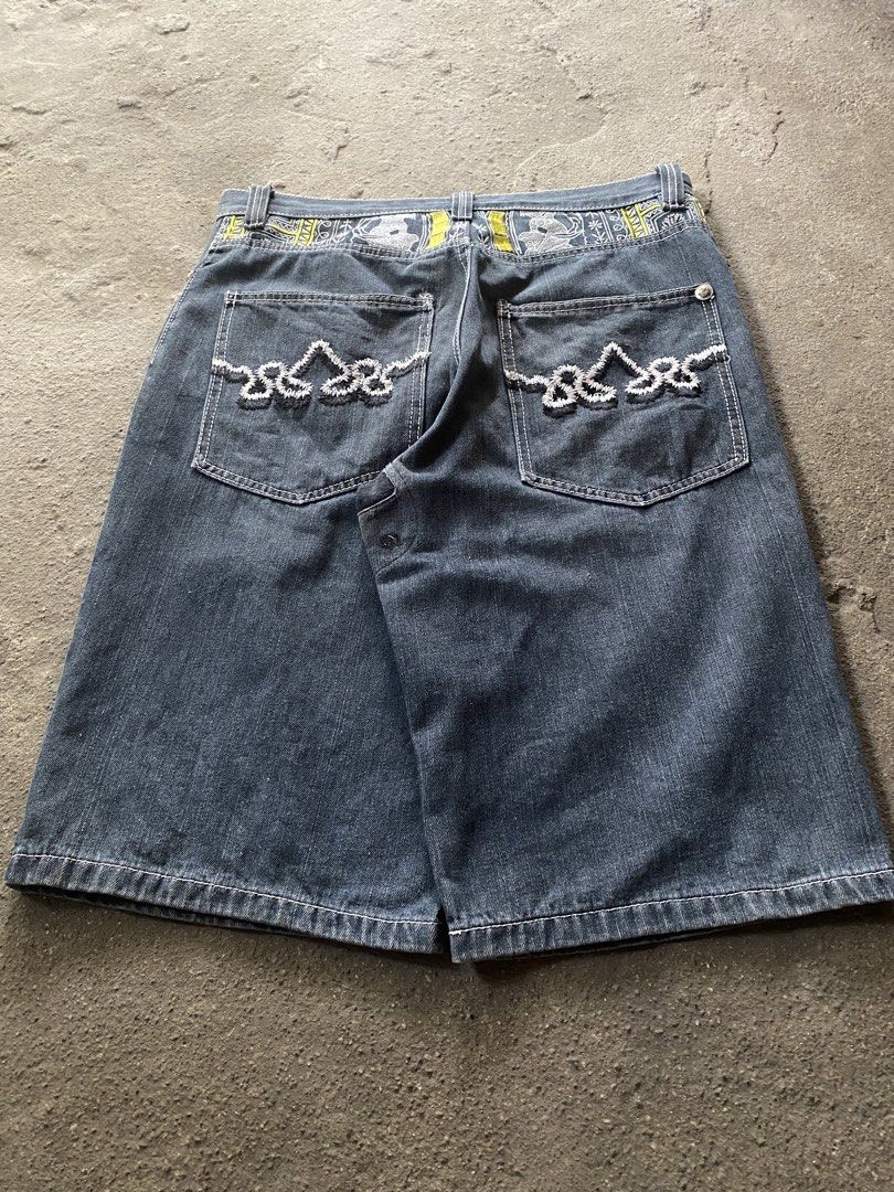 Crown Holder Embroidered Denim Jorts Y2K (Category: Shorts) located in Caloocan City. Submitted by remythrift (Listing ID 1470188348, Image 3). Description: - Brand/Model: Crown Holder denim jorts - Wash: Dark wash - Details: Heavy white and yellow embroidery on front panels and back waistband, detailed stitching on back pockets - Lining: Red inner waistband lining - Condition: Minor fraying and small repair near the hem and button area - Style: 