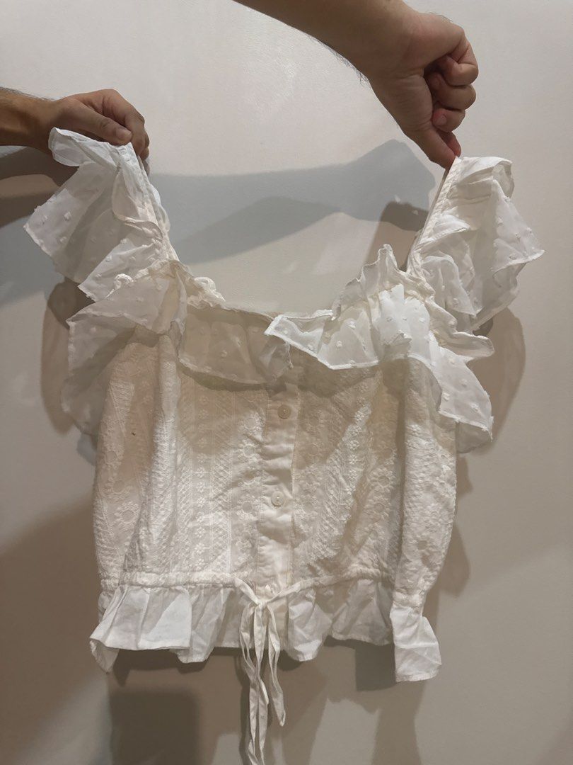 Dainty White Ruffle Crop Top (Category: Blouses) located in Makati City. Submitted by banshee1411 (Listing ID 1470241176, Image 1). Description: textured fabric.