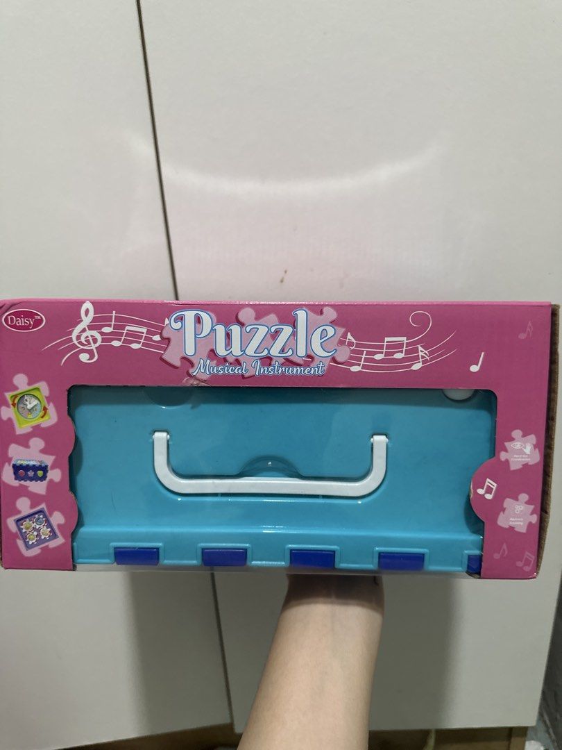 Daisy Puzzle Musical Instrument Toy Box (Category: Educational & Learning Toys) located in Manila. Submitted by ltncngco (Listing ID 1470161872, Image 1). Description: - Daisy puzzle musical instrument toy set - Great educational toy for kids to play and learn - Note: Box shows minor wear from storage .