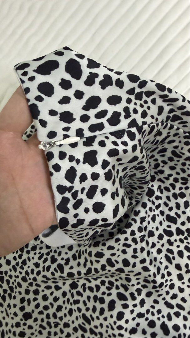Dalmatian Print Midi Skirt with Side Zip (Category: Skirts) located in Rizal. Submitted by kianapreloves (Listing ID 1470237560, Image 3). Description: - Trendy black and white dalmatian animal print - Smooth, high-quality fabric with a flattering high-waisted fit - Hits right around mid-calf length - Concealed side zipper for a seamless look - Clean waistline with a structured inner band for extra comfort.