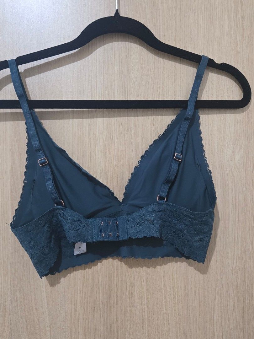 Danskin Teal Lace Bralette Size M (Category: Undergarments & Loungewear) located in Pasay City. Submitted by samcas (Listing ID 1470268758, Image 3). Description: - Brand: Danskin - Size: Medium - Color: Teal - Material/Design: Soft floral lace pattern - Straps: Adjustable branded straps with rose gold hardware - Details: Small round metal logo tag on the left cup - Closure: Hook-and-eye closure at the back.