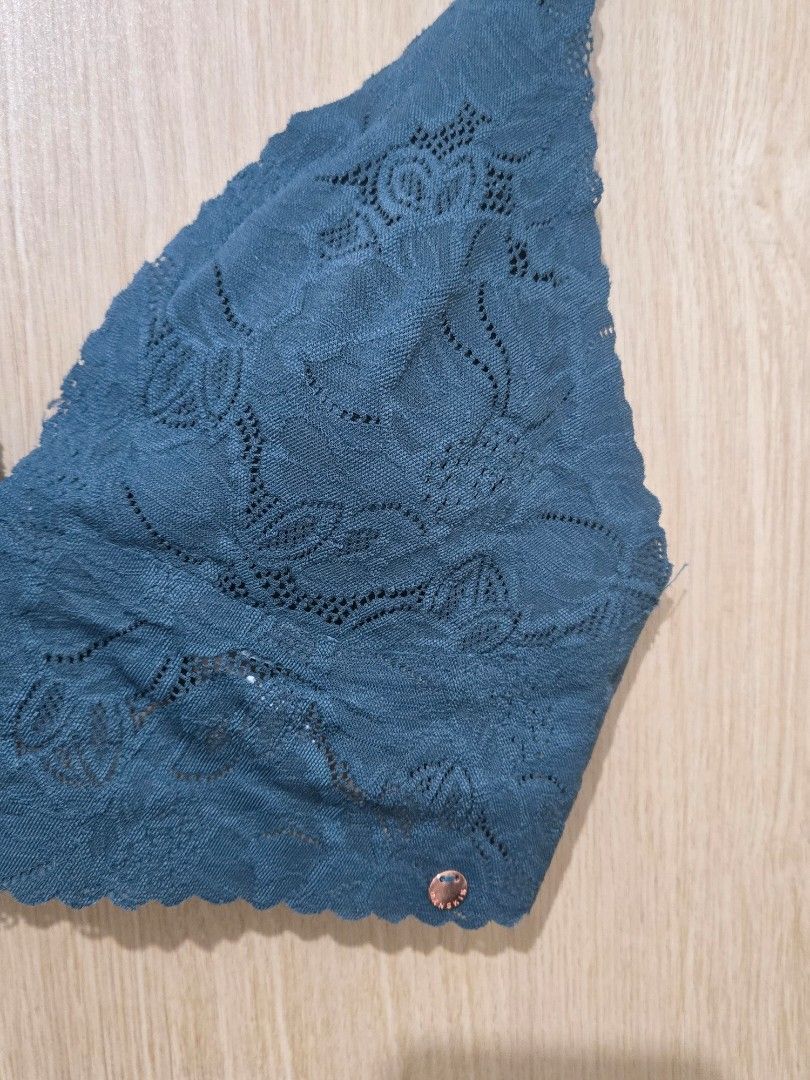 Danskin Teal Lace Bralette Size M (Category: Undergarments & Loungewear) located in Pasay City. Submitted by samcas (Listing ID 1470268758, Image 2). Description: - Brand: Danskin - Size: Medium - Color: Teal - Material/Design: Soft floral lace pattern - Straps: Adjustable branded straps with rose gold hardware - Details: Small round metal logo tag on the left cup - Closure: Hook-and-eye closure at the back.