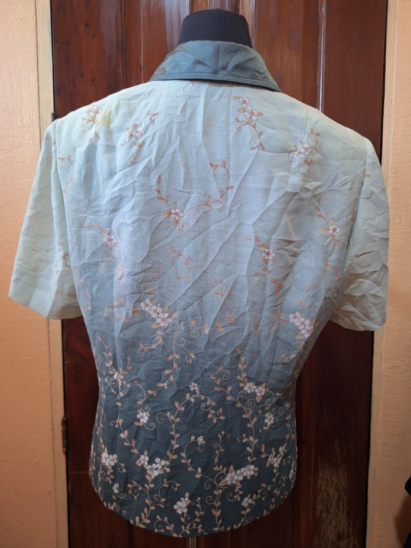 Dante Floral Short Sleeve Button-Up Blouse (Category: Blouses) located in Balamban. Submitted by ubethan (Listing ID 1470212332, Image 2). Description: - Brand: Dante - Style: Short sleeve button-down blouse with collared neckline and decorative round buttons - Design: Green and dark grey ombre effect with all-over white floral vine print - Fabric: Lightweight and comfortable - Condition: Brand new with tag intact.