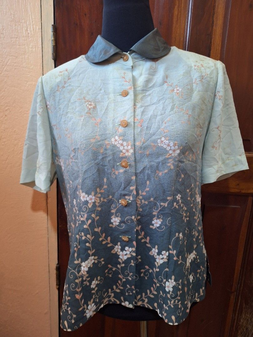 Dante Floral Short Sleeve Button-Up Blouse (Category: Blouses) located in Balamban. Submitted by ubethan (Listing ID 1470212332, Image 1). Description: - Brand: Dante - Style: Short sleeve button-down blouse with collared neckline and decorative round buttons - Design: Green and dark grey ombre effect with all-over white floral vine print - Fabric: Lightweight and comfortable - Condition: Brand new with tag intact.