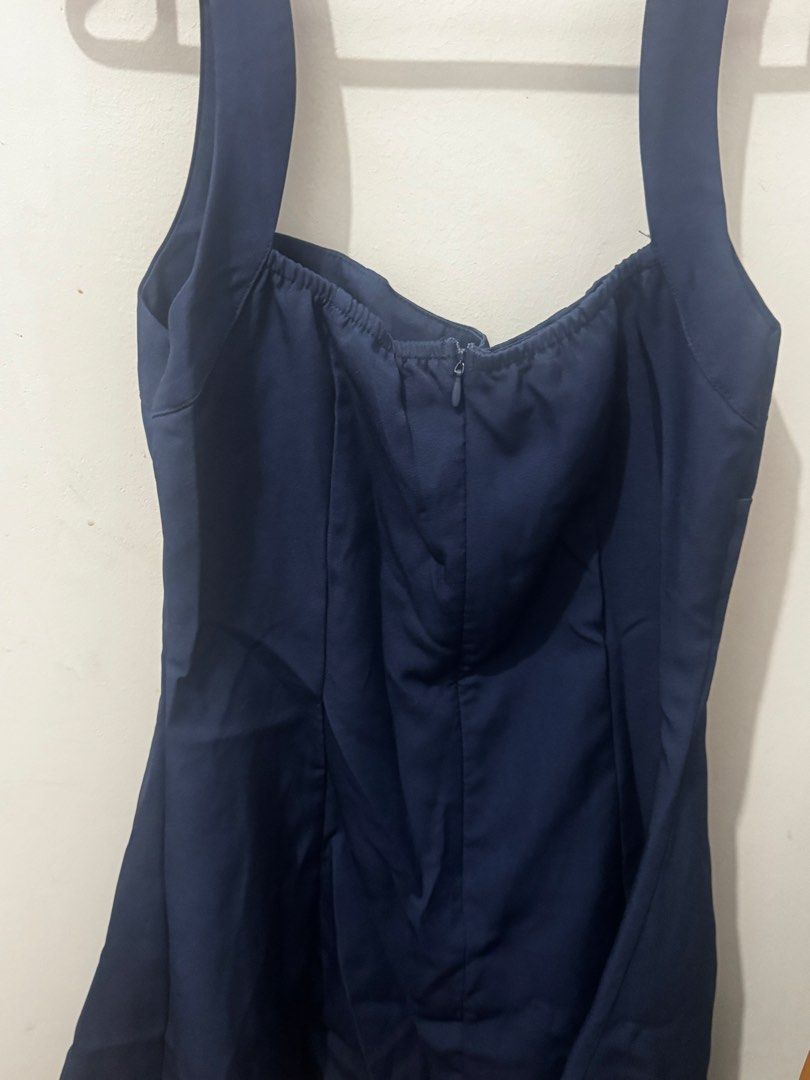 Dark Blue Square Neck Mini Dress (Category: Dresses) located in Marikina City. Submitted by potchayy (Listing ID 1470263914, Image 2). Description: - Color: Dark Blue / Solid Navy - Style: Sleeveless dress with square neckline and flared skirt - Fit: Fitted bodice with subtle shirring at the back edge for added comfort - Closure: Secure back zipper - Versatility: Perfect for casual day outs, dates, or brunch with the girls - Condition: Excellent,