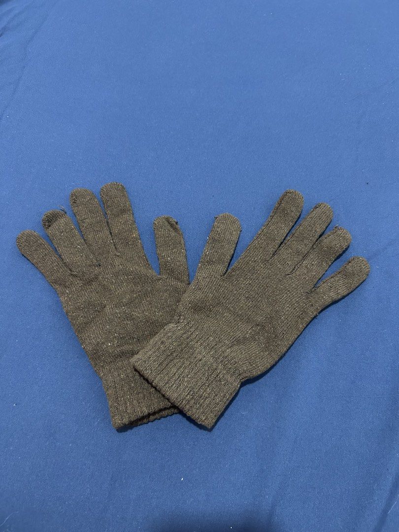 Dark brown knit winter gloves (Category: Gloves) located in Makati City. Submitted by aizy_sell (Listing ID 1470266407, Image 2). Description: - Color: Dark brown - Material: Soft woven knit texture - Features: Ribbed cuffs to keep out the cold - Fit: Flexible and comfortable - Style: Simple everyday winter wear Used once..
