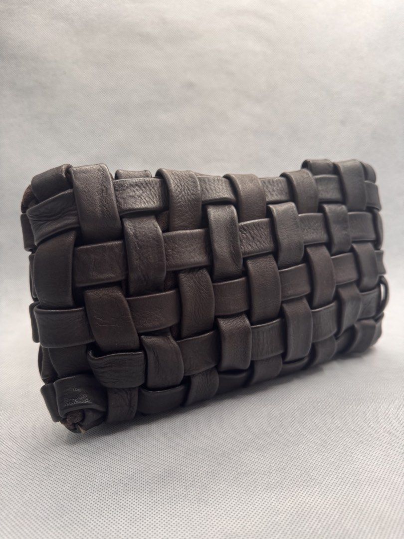 Dark Brown Woven Leather Clutch Bag (Category: Clutches) located in Las Pinas. Submitted by uynice.ph (Listing ID 1470251365, Image 2). Description: 🤎 BIG WEAVE CLUTCH | Distressed Italian Leather Effortlessly chic with a beautifully textured, woven design. Crafted from distressed leather for that soft, lived-in look with natural variations that give each piece its own character. ✨ Bag Details * Material: Genuine distressed leather * Color: Dark