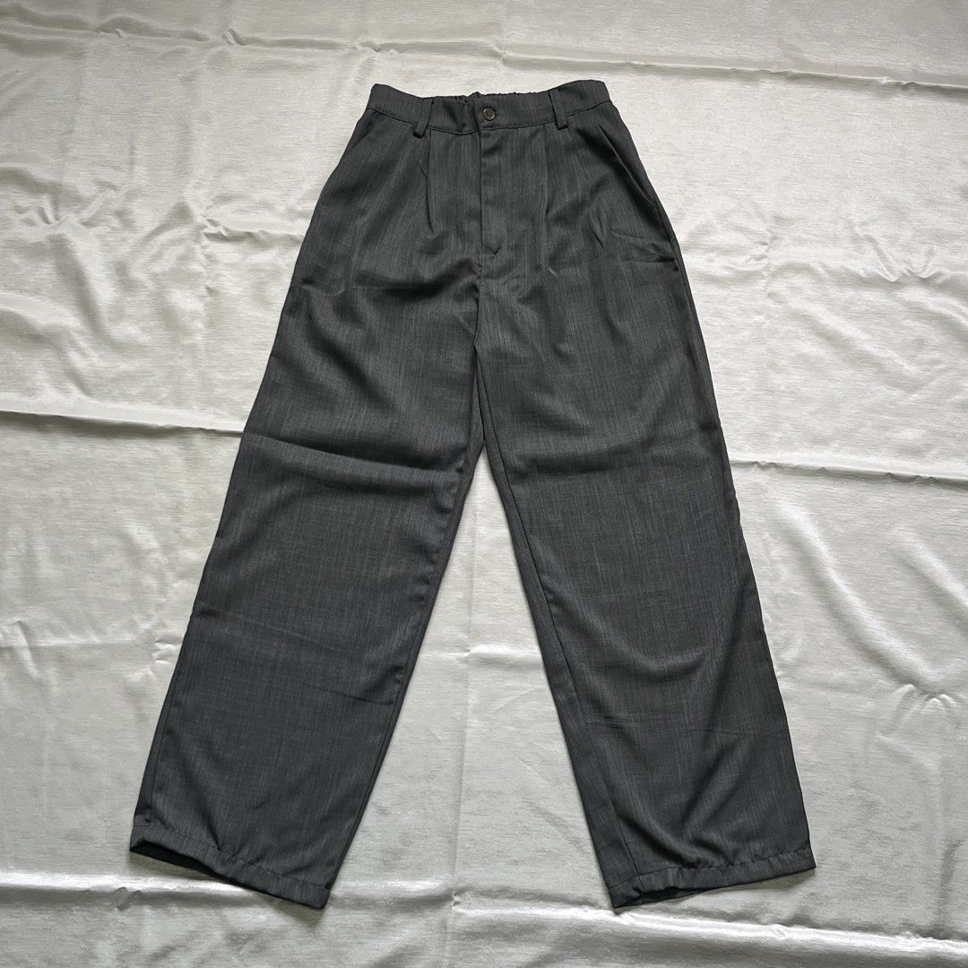 Dark Grey Pleated Wide Leg Trousers (Category: Trousers) located in Dasmarinas. Submitted by minx203 (Listing ID 1470297833, Image 1). Description: - Color: Dark grey with clean heather texture finish - Cut: Wide leg with a relaxed straight silhouette - Details: Front pleats, button closure, and belt loops - Style: Versatile daily piece, easy to dress up or down.