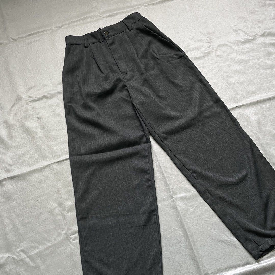 Dark Grey Pleated Wide Leg Trousers (Category: Trousers) located in Dasmarinas. Submitted by minx203 (Listing ID 1470297833, Image 2). Description: - Color: Dark grey with clean heather texture finish - Cut: Wide leg with a relaxed straight silhouette - Details: Front pleats, button closure, and belt loops - Style: Versatile daily piece, easy to dress up or down.