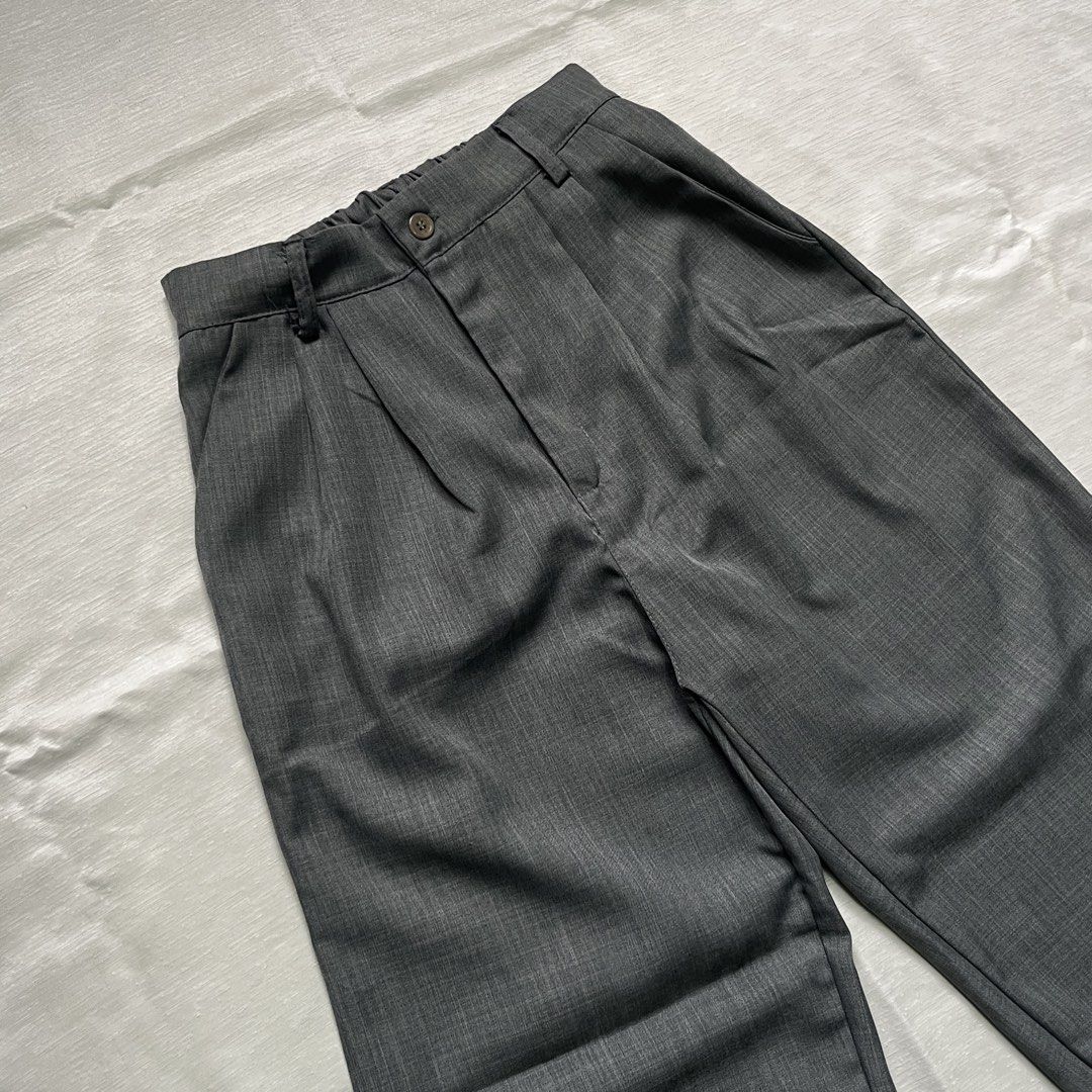 Dark Grey Pleated Wide Leg Trousers (Category: Trousers) located in Dasmarinas. Submitted by minx203 (Listing ID 1470297833, Image 3). Description: - Color: Dark grey with clean heather texture finish - Cut: Wide leg with a relaxed straight silhouette - Details: Front pleats, button closure, and belt loops - Style: Versatile daily piece, easy to dress up or down.