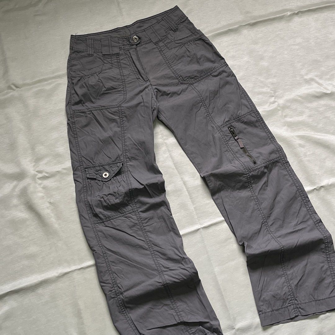 Dark Grey Utility Cargo Pants with Multiple Pockets (Category: Jeans) located in Dasmarinas. Submitted by minx203 (Listing ID 1470298333, Image 2). Description: - Color: Dark grey - Fit: Mid-rise, relaxed straight leg - Material: Sturdy, durable fabric - Pockets: Multiple utility pockets, including snap-button cargo on the right and zippered on the left - Details: Structured paneling and belt loops - Closure: Front button and zip fly.