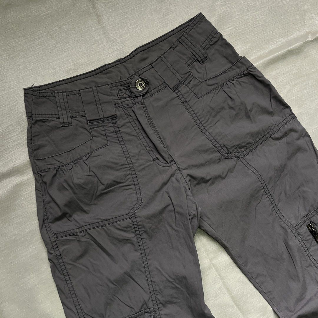 Dark Grey Utility Cargo Pants with Multiple Pockets (Category: Jeans) located in Dasmarinas. Submitted by minx203 (Listing ID 1470298333, Image 3). Description: - Color: Dark grey - Fit: Mid-rise, relaxed straight leg - Material: Sturdy, durable fabric - Pockets: Multiple utility pockets, including snap-button cargo on the right and zippered on the left - Details: Structured paneling and belt loops - Closure: Front button and zip fly.