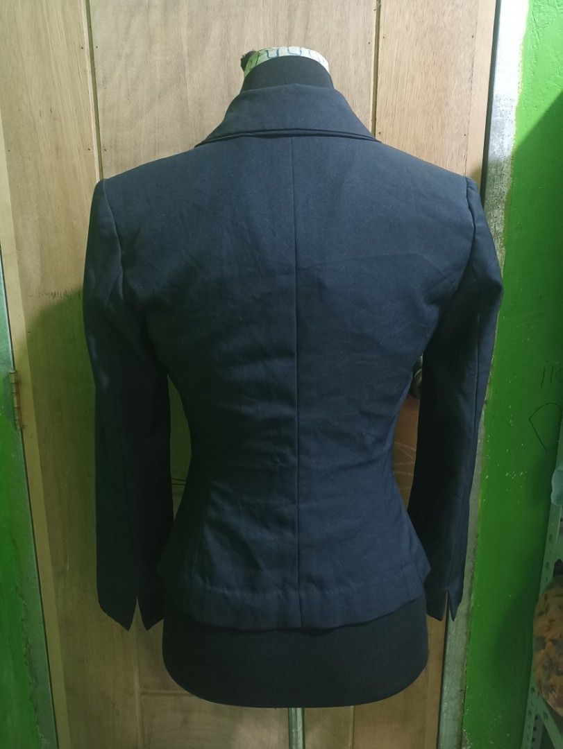 Dark Navy Blue Fitted Formal Blazer (Category: Coats, Jackets and Outerwear) located in Tarlac. Submitted by allinoneshop2178 (Listing ID 1470252833, Image 3). Description: - Color: Dark navy blue - Silhouette: Structured with a fitted waist - Closure: Two black front buttons - Pockets: Flap pockets on both sides - Details: Clean lapel collar, long sleeves with slit cuffs - Fabric: Smooth inside and out - Ideal for: Workwear, interviews, and form