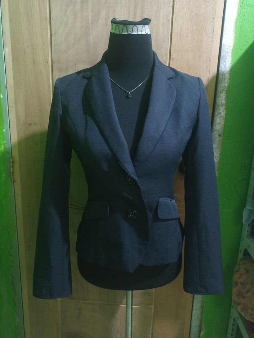 Dark Navy Blue Fitted Formal Blazer (Category: Coats, Jackets and Outerwear) located in Tarlac. Submitted by allinoneshop2178 (Listing ID 1470252833, Image 1). Description: - Color: Dark navy blue - Silhouette: Structured with a fitted waist - Closure: Two black front buttons - Pockets: Flap pockets on both sides - Details: Clean lapel collar, long sleeves with slit cuffs - Fabric: Smooth inside and out - Ideal for: Workwear, interviews, and form