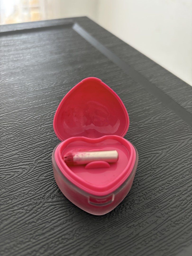 Dasique Souffle Color Pot 11 Cherry Custard (Category: Makeup) located in Binan City. Submitted by laurenarriane_owl (Listing ID 1470143056, Image 3). Description: - Brand: Dasique - Product: Souffle Color Pot - Shade: 11 Cherry Custard - Packaging: Heart-shaped compact with pink lid and clear base - Condition: Gently swatched in the center - Inclusion: Small applicator brush included inside the case - Origin: Made in Korea - Expiry Date: Novembe