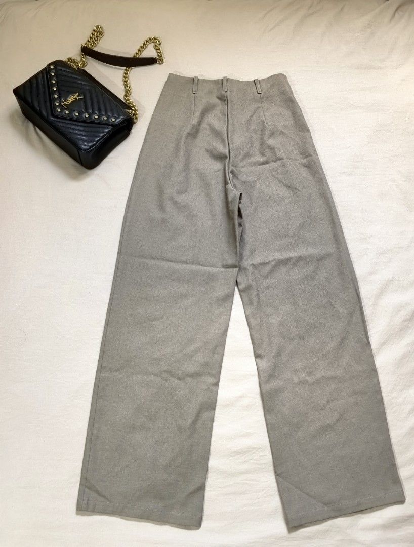Dazy Beige High-Waisted Wide-Leg Pants (Category: Other Bottoms) located in Tacloban City. Submitted by thead.declutters (Listing ID 1470209038, Image 2). Description: - Brand: Dazy - Size: S - Color: Neutral beige - Fit: High-waisted wide-leg - Details: Front pleats, side pockets, clean back design with belt loops - Material: Lightweight polyester and elastane blend with a bit of stretch - Styling: Versatile for casual outings or office wear.