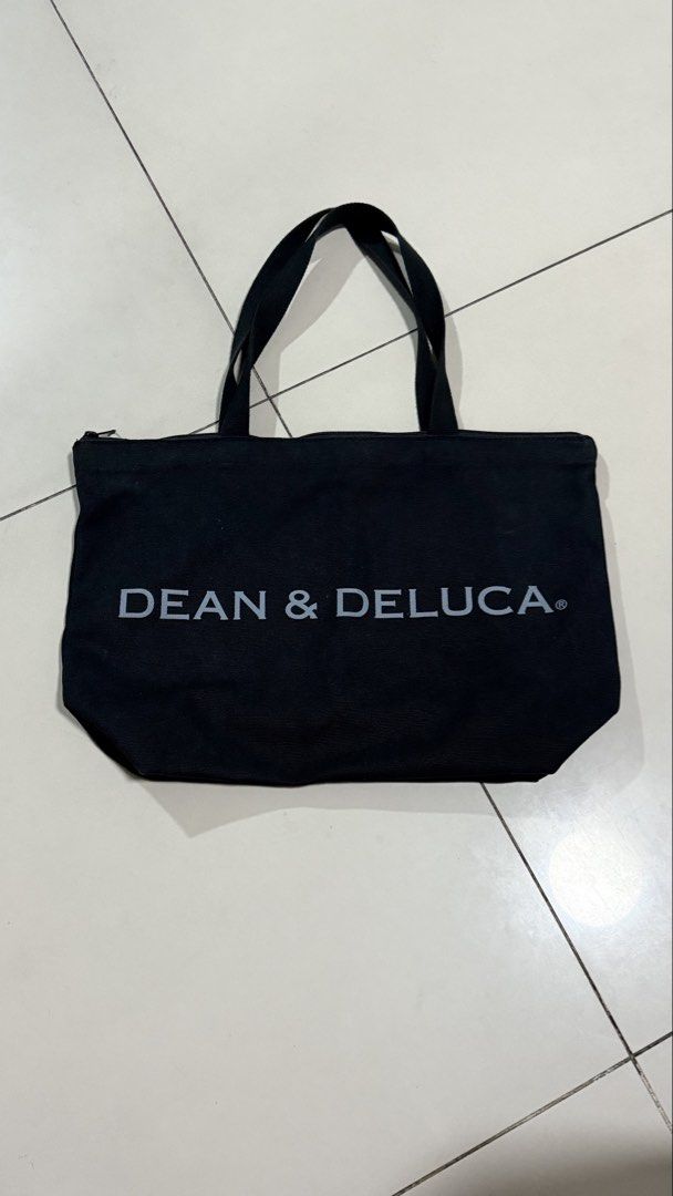 Dean & Deluca Canvas Tote Bag Large (Category: Tote Bags) located in Manila. Submitted by mkyscloset (Listing ID 1470297569, Image 1). Description: - Brand: Dean & Deluca - Style: Large canvas tote bag - Color: Black with grey logo text - Upgrades: Custom top zipper installed for extra security - Condition: Slightly used, solid and well-maintained shape - Original Price: PHP 1,600 - Perfect everyday carry-all for work, school, or errands!.
