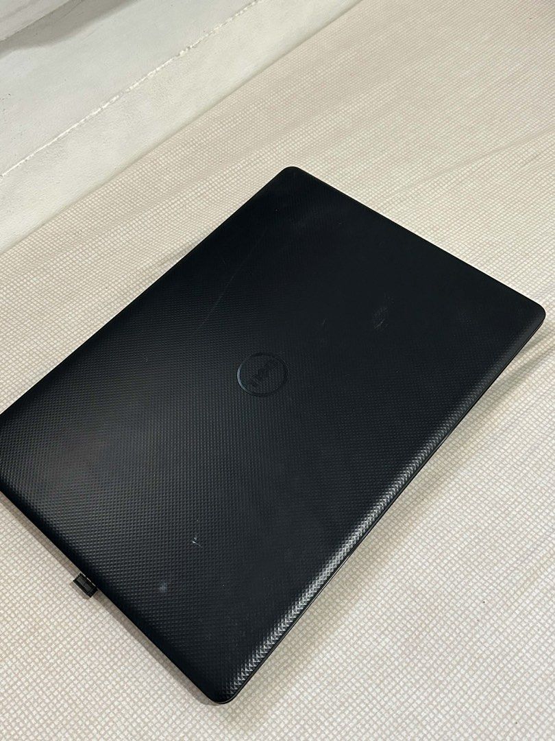 Dell Vostro 3491 Laptop (Category: Laptops & Notebooks) located in Paranaque City. Submitted by knotsndlove (Listing ID 1470290385, Image 2). Description: - Model: Dell Vostro 3491 (Black) - Condition: Working, boots to Windows sign-in screen; normal signs of daily use on chassis - Keyboard: Standard QWERTY layout with trackpad and textured keyboard deck - Included: Power adapter (slight fraying near the strain relief) - Details: Model number and