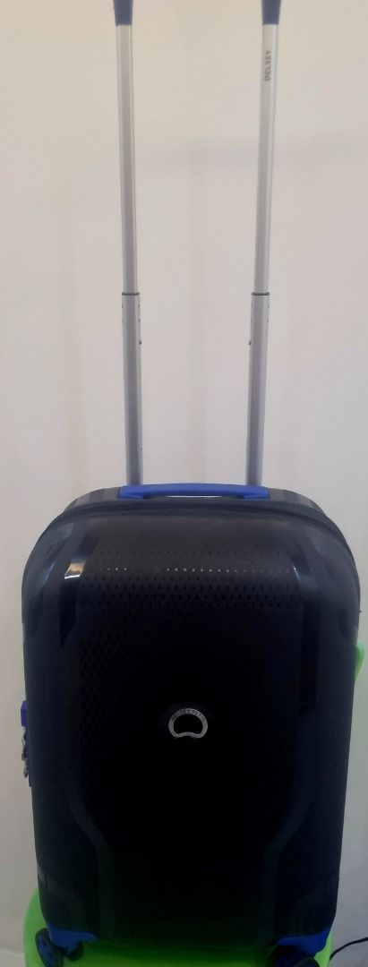 Delsey Paris Black Blue Spinner Suitcase Hard Shell (Category: Luggage) located in Mandaluyong City. Submitted by jomont (Listing ID 1470169029, Image 2). Description: - Brand: Delsey Paris - Color: Black with bold blue accents - Size: Ideal for weekend trips and carry-on travel - Mobility: 4 smooth-rolling wheels and a smooth telescoping handle - Security: Built-in combination lock for main zippers - Design: Durable hard shell with a perforated 