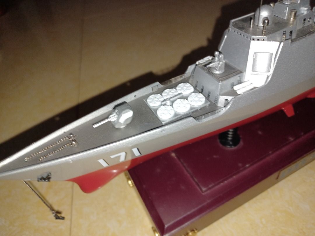 Detailed Warship Model with Display Stand (Category: Action & Battle Toys) located in Santa Rosa. Submitted by rheitan (Listing ID 1470144865, Image 3). Description: - Detailed plastic warship model (Hull No. 171) - Painted grey hull with realistic red bottom - Intricate deck features including radar masts, missile launchers, and a miniature helicopter - Pre-assembled and painted to a high standard - Mounted on a polished wooden display stand wit