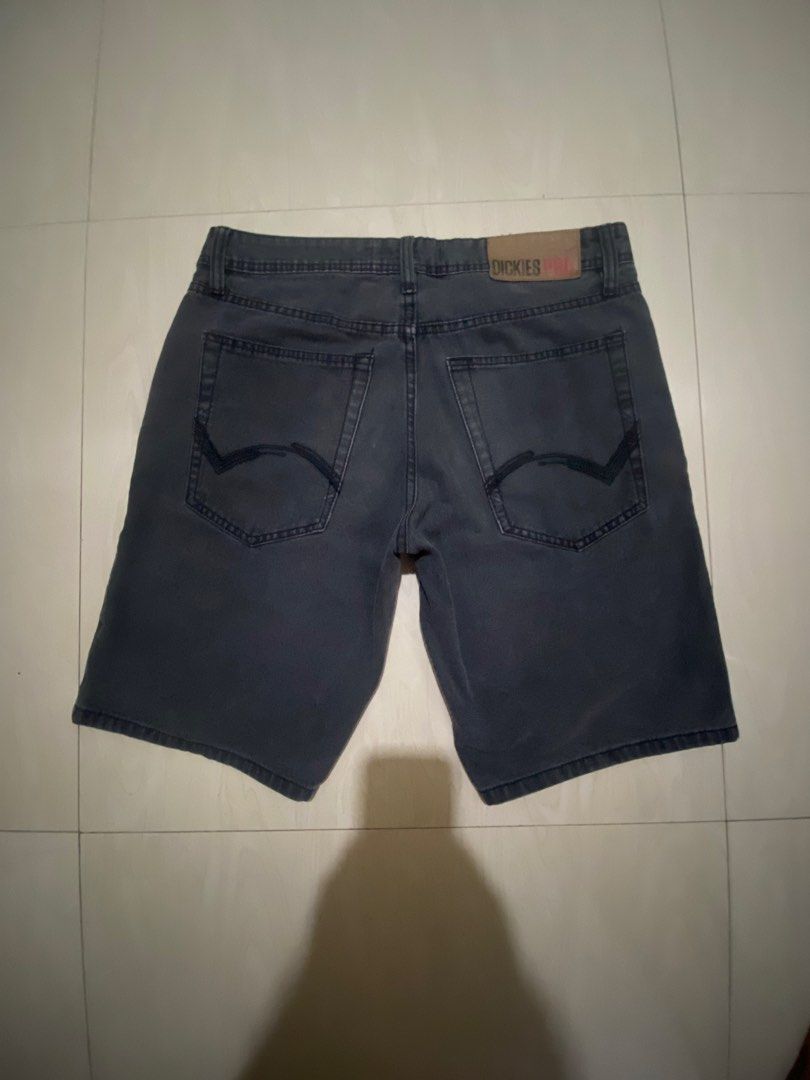 Dickies Slim Denim Shorts Size 32 (Category: Shorts) located in Vinzons. Submitted by gabrielvic (Listing ID 1470206234, Image 1). Description: - Brand: Dickies - Color: Dark wash grey with a unique herringbone pattern - Size: 32 waist - Fit: Slim fit - Details: Metal button closure with logo engraving, branded leather patch on the back waistband - Pockets: Classic five-pocket design including a coin pocket - Style: Sturdy construction, solid str