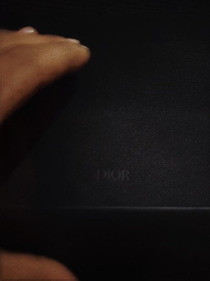 Dior Eyewear Case Black Leather with Monogram Patch (Category: Luxury Bags & Wallets) located in Baguio. Submitted by angeloshoppebaguio2600 (Listing ID 1470302731, Image 3). Description: - Authentic Dior black leather eyewear case - Large debossed DIOR logo on the front - Textured monogram patch with silver-tone rivets on the back - Sturdy structure for ultimate glasses and sunglasses protection - Black fabric interior with 'CASE MADE IN CHINA' 