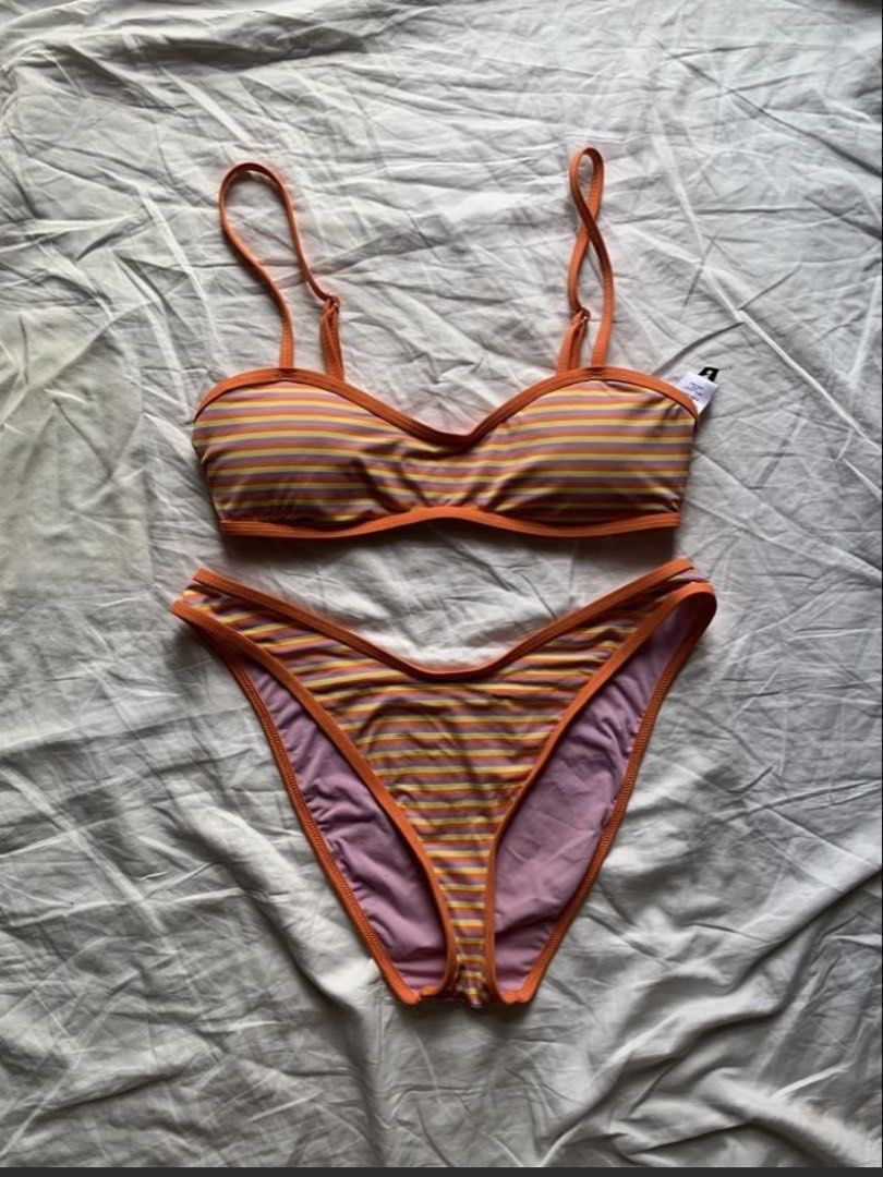 Dippin’ Daisy’s Stripe Bikini Set (Category: Bikinis & Swimsuits) located in Taguig. Submitted by prelovedbynette (Listing ID 1470317226, Image 2). Description: For size, pls refer to the size chart from the brand’s official website (see last photo) Top is size S with adjustable straps Bottom is size M With minimal stain at the back of the top (see 7th photo) Set retails for 6-7k Helping tags: Blackbough, H&M, Eight Mermaid.