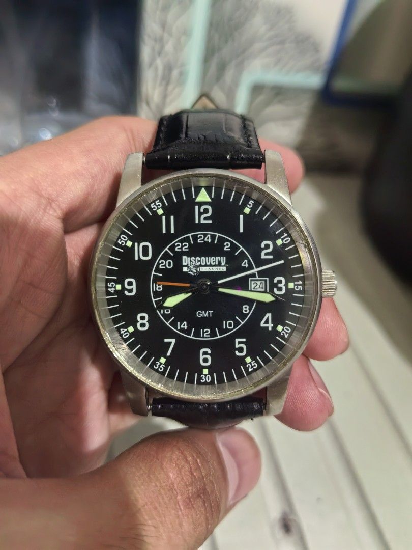 Discovery Channel GMT Pilot Watch Black Dial Leather Strap (Category: Men's Watches) located in Batangas. Submitted by human.made (Listing ID 1470235642, Image 1). Description: - 2002 Discovery Channel GMT pilot watch - Classic black dial featuring bold white numerals and a 24-hour inner ring - Convenient date window located at the 3 o'clock position - Premium black embossed leather strap paired with a durable steel buckle - Stainless steel case 