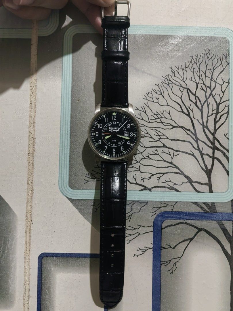 Discovery Channel GMT Pilot Watch Black Dial Leather Strap (Category: Men's Watches) located in Batangas. Submitted by human.made (Listing ID 1470235642, Image 3). Description: - 2002 Discovery Channel GMT pilot watch - Classic black dial featuring bold white numerals and a 24-hour inner ring - Convenient date window located at the 3 o'clock position - Premium black embossed leather strap paired with a durable steel buckle - Stainless steel case 