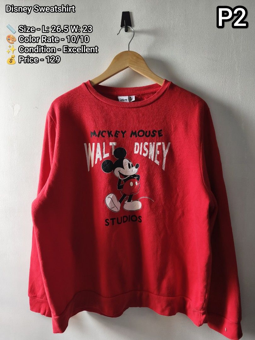 Disney Walt Disney Studios Mickey Mouse Red Sweatshirt Size L (Category: Coats, Jackets and Outerwear) located in Manila. Submitted by gelog2 (Listing ID 1470166072, Image 1). Description: - Design: Bright red Disney sweatshirt with iconic Mickey Mouse graphic and Walt Disney Studios print details - Fit & Style: Classic crewneck, long sleeves, with comfortable ribbed cuffs and hem - Condition: Vibrant color with no fading - Measurements: Length 2