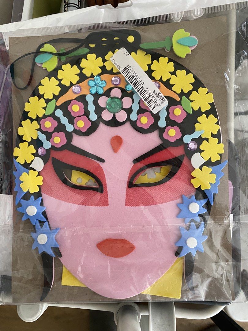 DIY Chinese Opera Mask Craft Kit (Category: Handmade Craft) located in Makati City. Submitted by rye16 (Listing ID 1470176678, Image 1). Description: - DIY Chinese Opera mask craft kit - Pink face design featuring striking yellow eyes - Includes colorful foam flowers, floral accents, and black hairpieces - All pieces securely sealed on original cardboard backing - Perfect activity for kids or cultural projects.