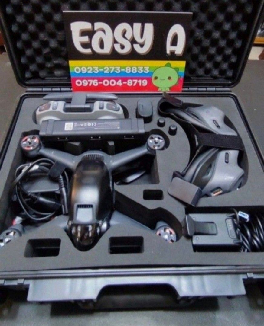 DJI FPV Drone Combo with Goggles and Controller and Hard Box (Category: Drones) located in Manila. Submitted by easy_a (Listing ID 1470178403, Image 1). Description: - Complete DJI FPV drone bundle ready for setup and flight - Includes drone aircraft, FPV goggles, and remote controller - Comes with intelligent flight battery, charging hub, cables, and spare joysticks - Packed in a durable hard foam carry case with custom cutouts for a snug fit - 