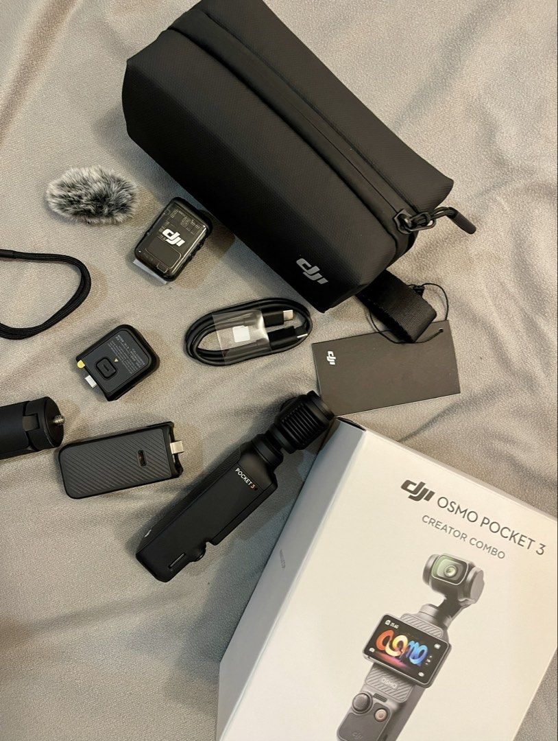 DJI Osmo Pocket 3 Creator Combo (Category: Cameras) located in Quezon City. Submitted by blurstuff (Listing ID 1470321941, Image 2). Description: - Complete DJI Osmo Pocket 3 Creator Combo set - Includes camera, battery handle, mini tripod, and carrying bag - Comes with DJI Mic 2 transmitter, wind muff, and wrist strap - Includes original retail box and cables - Ideal all-in-one setup for vlogging, travel videos, and content creation W/ FREE acce