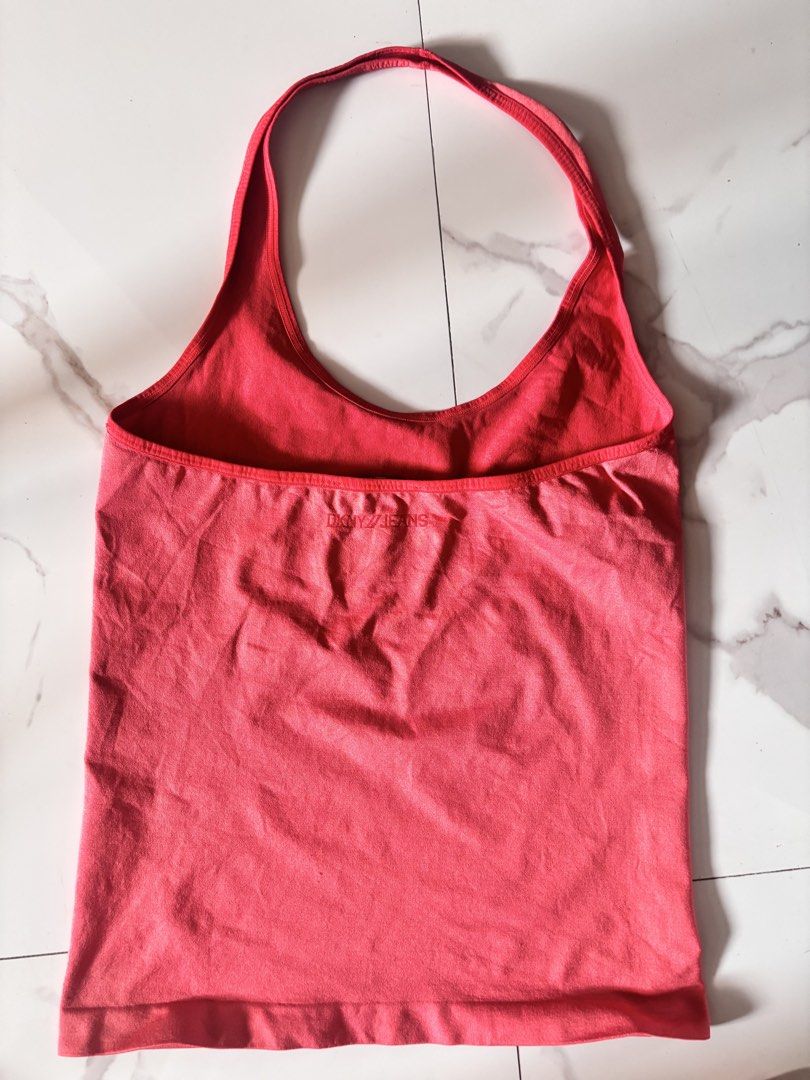 DKNY Halter Top (Category: Sleeveless) located in Manila. Submitted by minieiv._ (Listing ID 1470202265, Image 2). Description: * Pre-loved * Slightly used, 9/10 condition * US bought * Size: US M/L * Nylon Spandex, stretchable * Meetup: Puregold San Mateo, Ampid Mercury * RFS: Decluttering.
