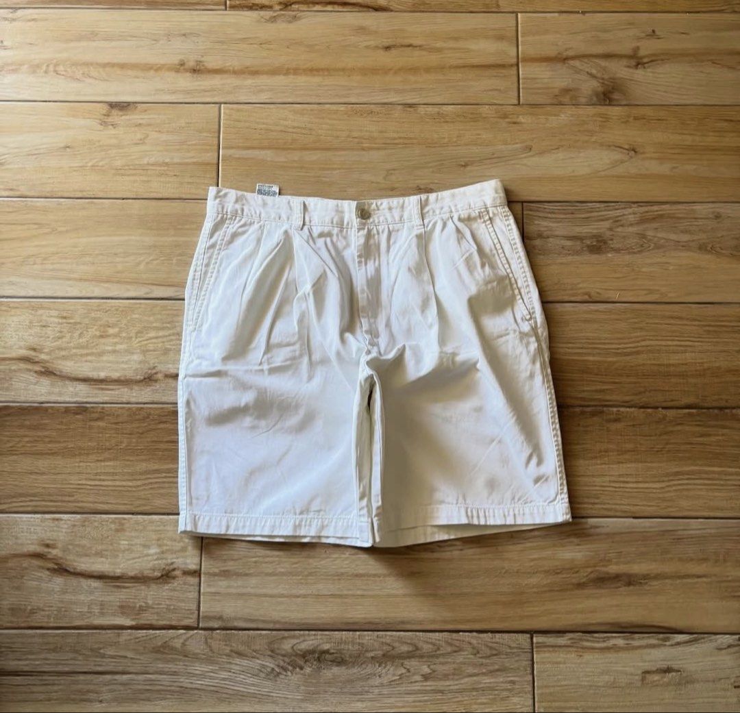 Dockers White Pleated Cotton Shorts (Category: Shorts) located in Manila. Submitted by fcaleb022713960 (Listing ID 1470230014, Image 1). Description: - Brand: Dockers - Color: Clean White - Material: 100% Cotton - Design: Pleated front, standard belt loops, button closure, two back welt pockets with button closures - Condition: Minimal wear on fabric and seams, excellent pre-loved condition - Style: Classic casual, perfect for warm weather - W 34