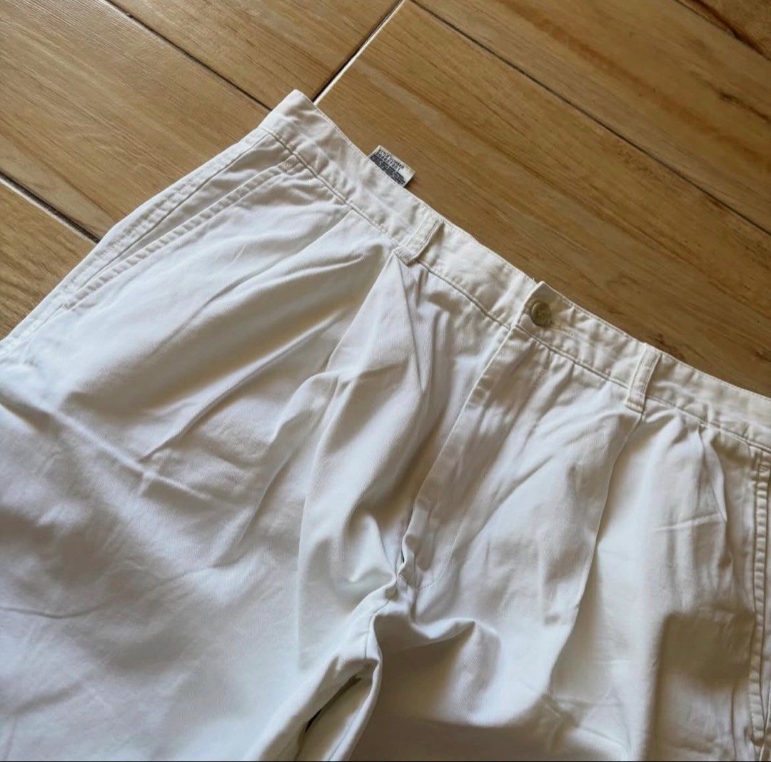 Dockers White Pleated Cotton Shorts (Category: Shorts) located in Manila. Submitted by fcaleb022713960 (Listing ID 1470230014, Image 2). Description: - Brand: Dockers - Color: Clean White - Material: 100% Cotton - Design: Pleated front, standard belt loops, button closure, two back welt pockets with button closures - Condition: Minimal wear on fabric and seams, excellent pre-loved condition - Style: Classic casual, perfect for warm weather - W 34