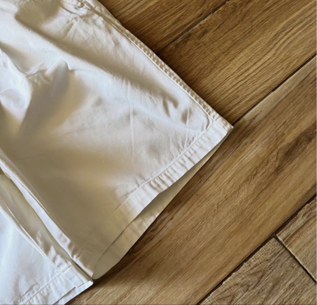 Dockers White Pleated Cotton Shorts (Category: Shorts) located in Manila. Submitted by fcaleb022713960 (Listing ID 1470230014, Image 3). Description: - Brand: Dockers - Color: Clean White - Material: 100% Cotton - Design: Pleated front, standard belt loops, button closure, two back welt pockets with button closures - Condition: Minimal wear on fabric and seams, excellent pre-loved condition - Style: Classic casual, perfect for warm weather - W 34